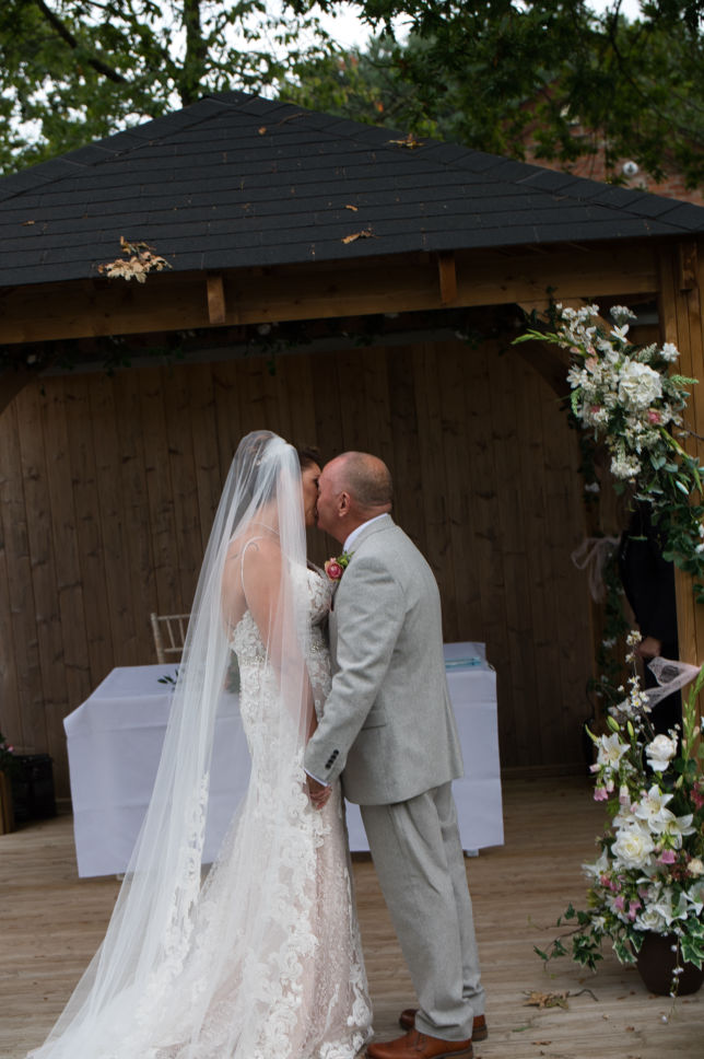 Bride and groom kissing 