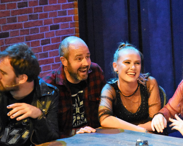 Actors and man on stage in Theatre stage show 