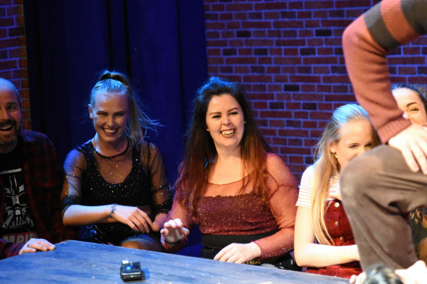 man on stage in Theatre stage show 